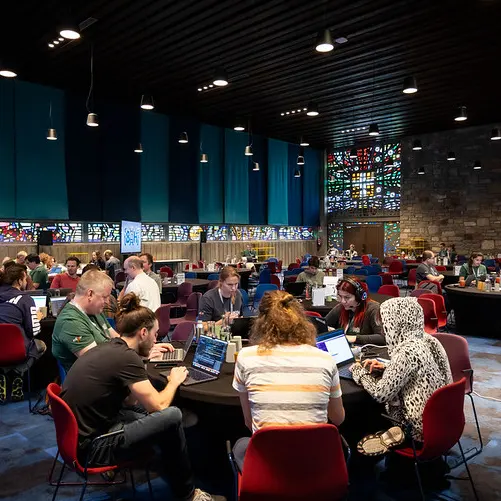 Tables of hackers in the main hall